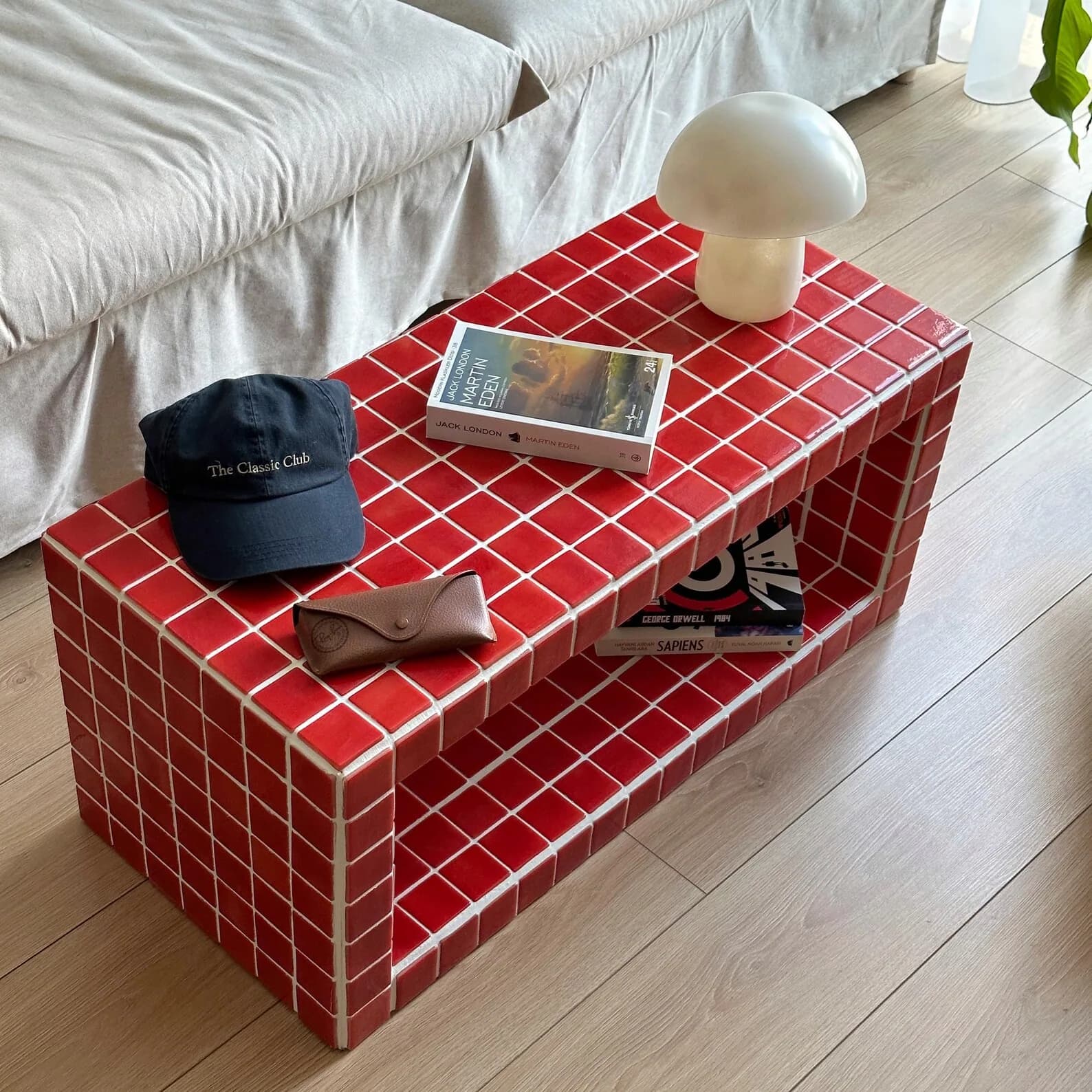 Low bench faced in red square tile