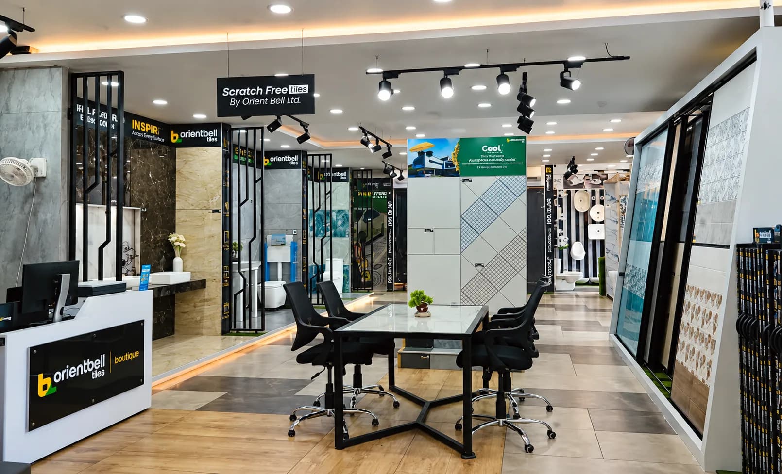 The Sakthi showroom at Old Pallavaram today, its lit tile display bays running either side of a central consultation table