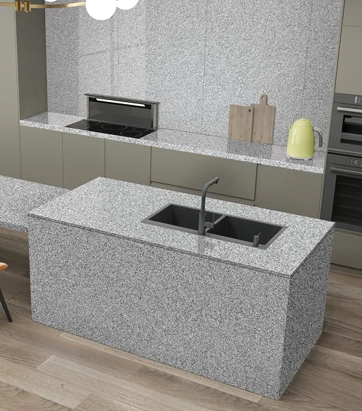 Speckled grey granite-look countertop and matching kitchen island