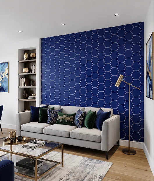 Living room with a navy hexagonal-patterned tile feature wall behind a grey sofa