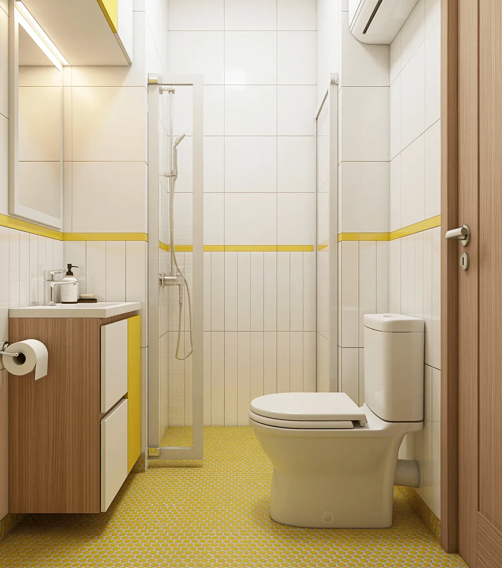 Small bathroom in white tile with a yellow trim band and a yellow penny-round mosaic floor