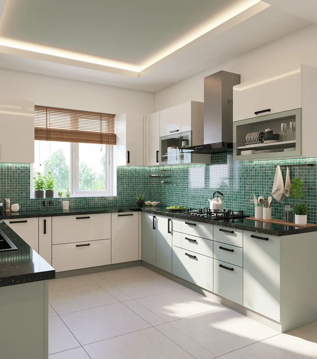 Kitchen with a green mosaic-tile backsplash, sage cabinetry and a dark countertop